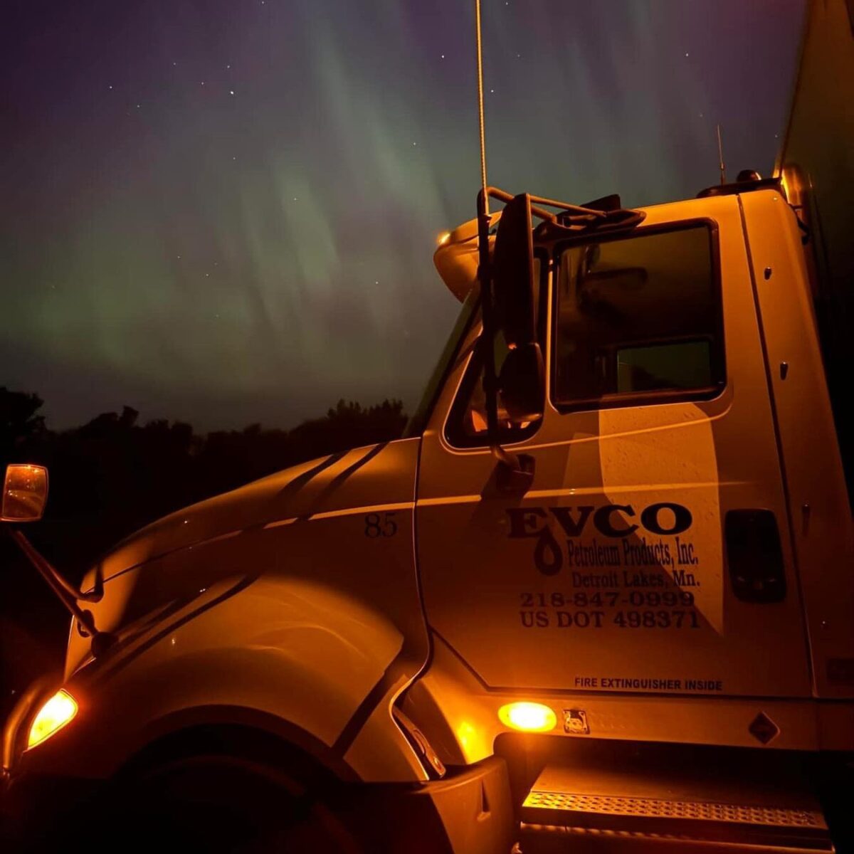 Truck with EVCO logo on door and northern lights